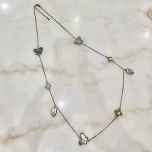 Long chain of brown mother of pearl inlaid charms